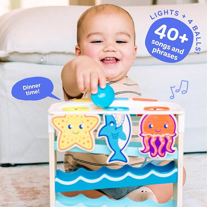 Move2Play, Wooden Ocean Friends | 30+ Fin-Tastic Songs & Phrases | Baby & Toddler Musical Toy | First Birthday Present for 1+ Year Old | Ages 6-24 Months | Boy & Girl Ball Drop Toy