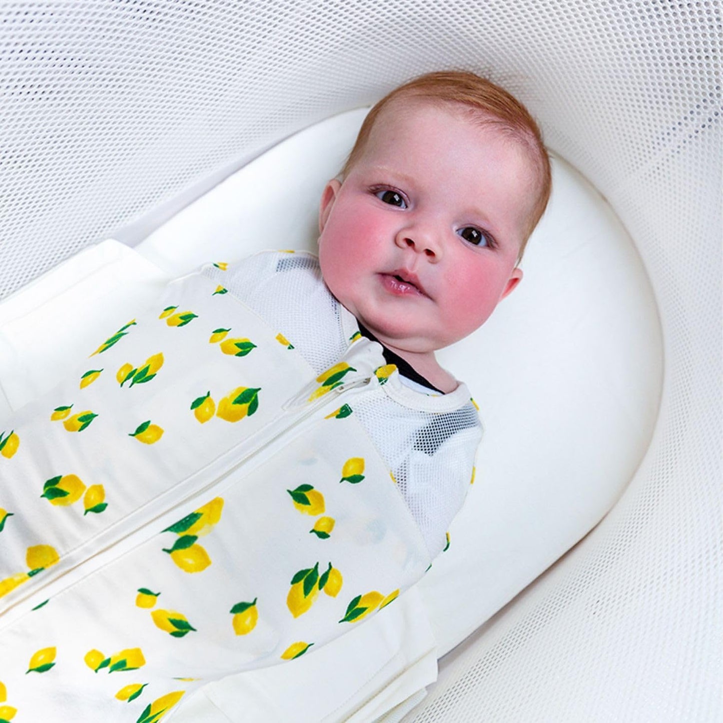 Happiest Baby SNOO Sleep Sack - 100% Organic Cotton Baby Swaddle Blanket - Doctor Designed Promotes Healthy Hip Development (Ivory Lemons, Medium)